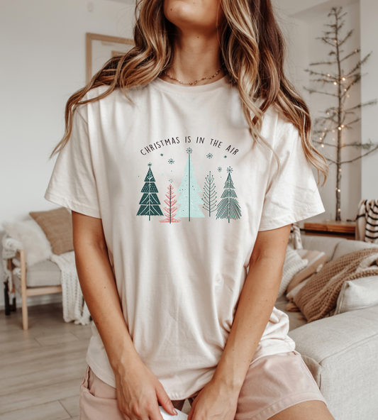 Christmas Is In The Air T-Shirt — Minimal Pastel Holiday Tree Tee